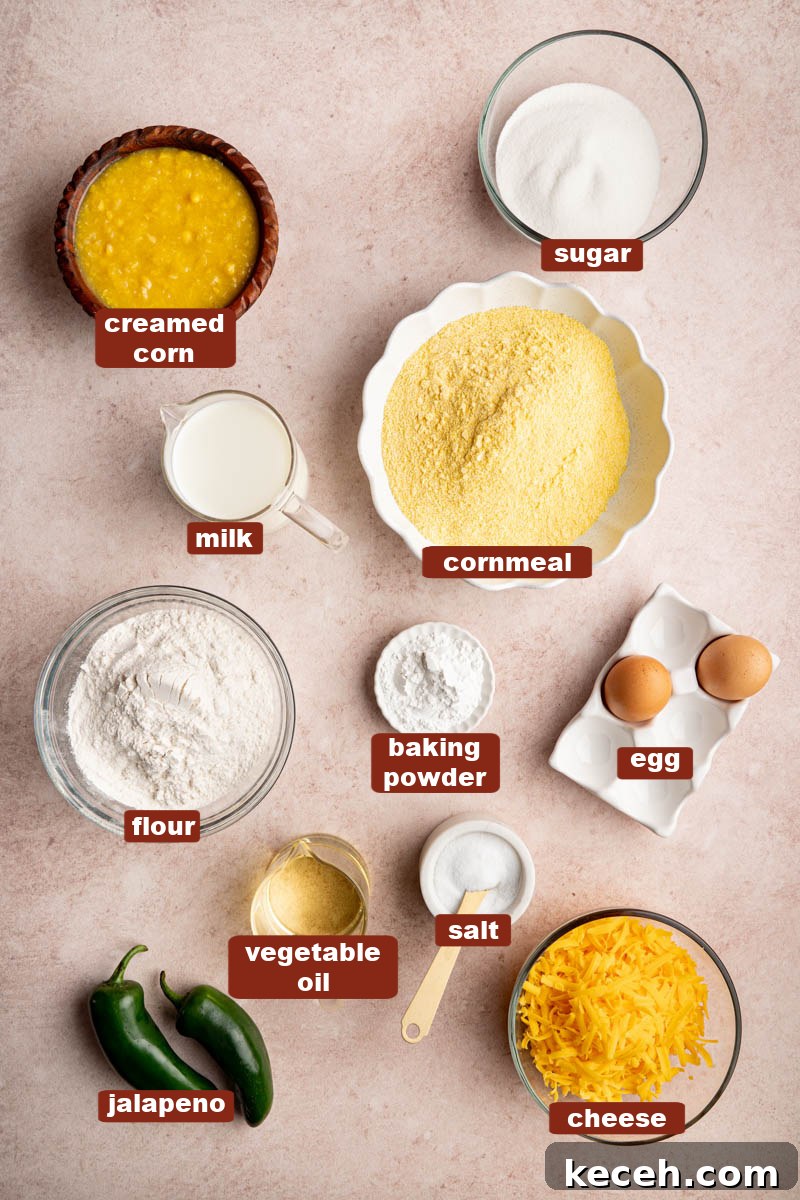 Spicy Jalapeño Cheddar Cornbread Recipe 2 All of the ingredients for jalapeno cheddar cornbread in bowls on a countertop.