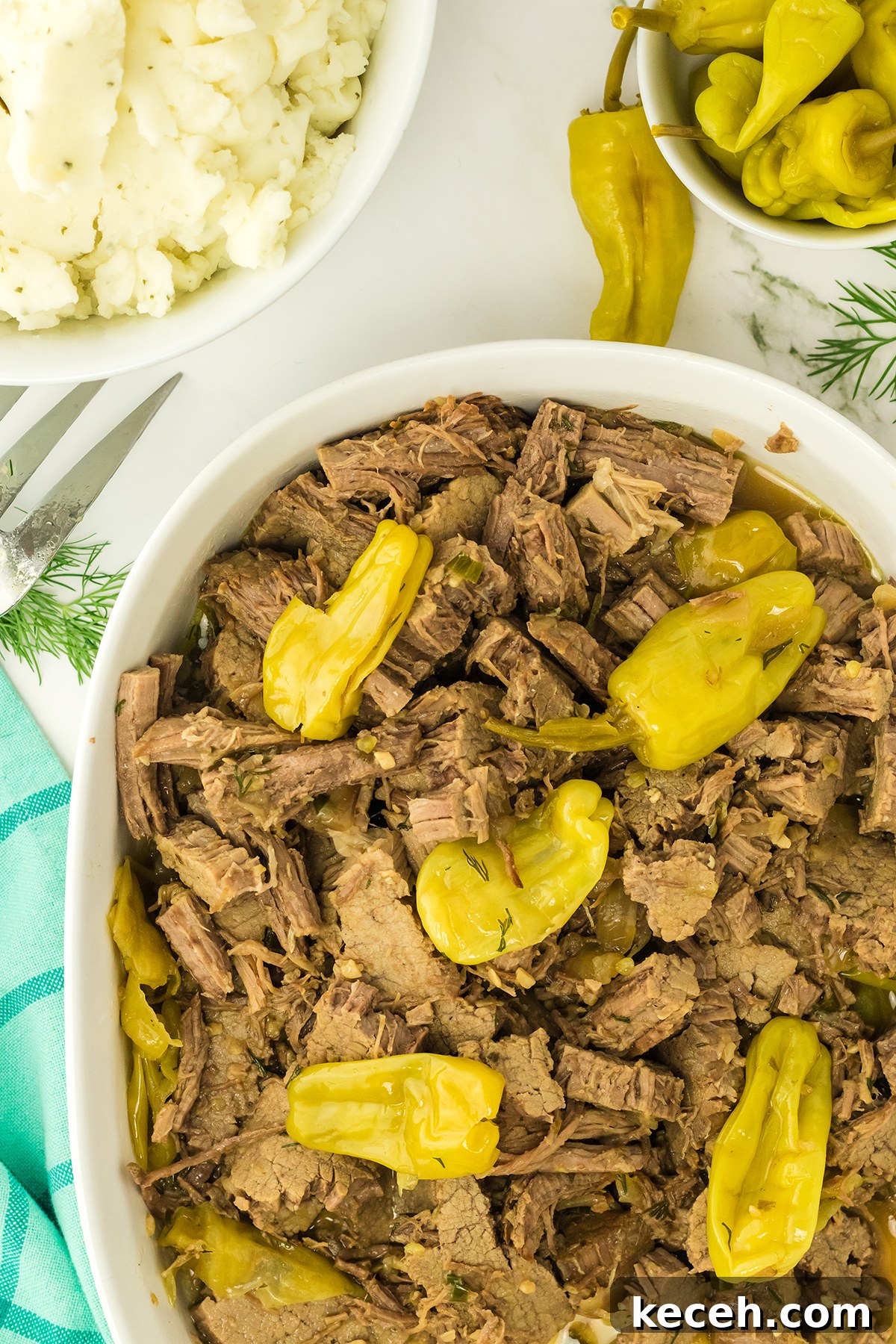 Mississippi Pot Roast served in white casserole dish.