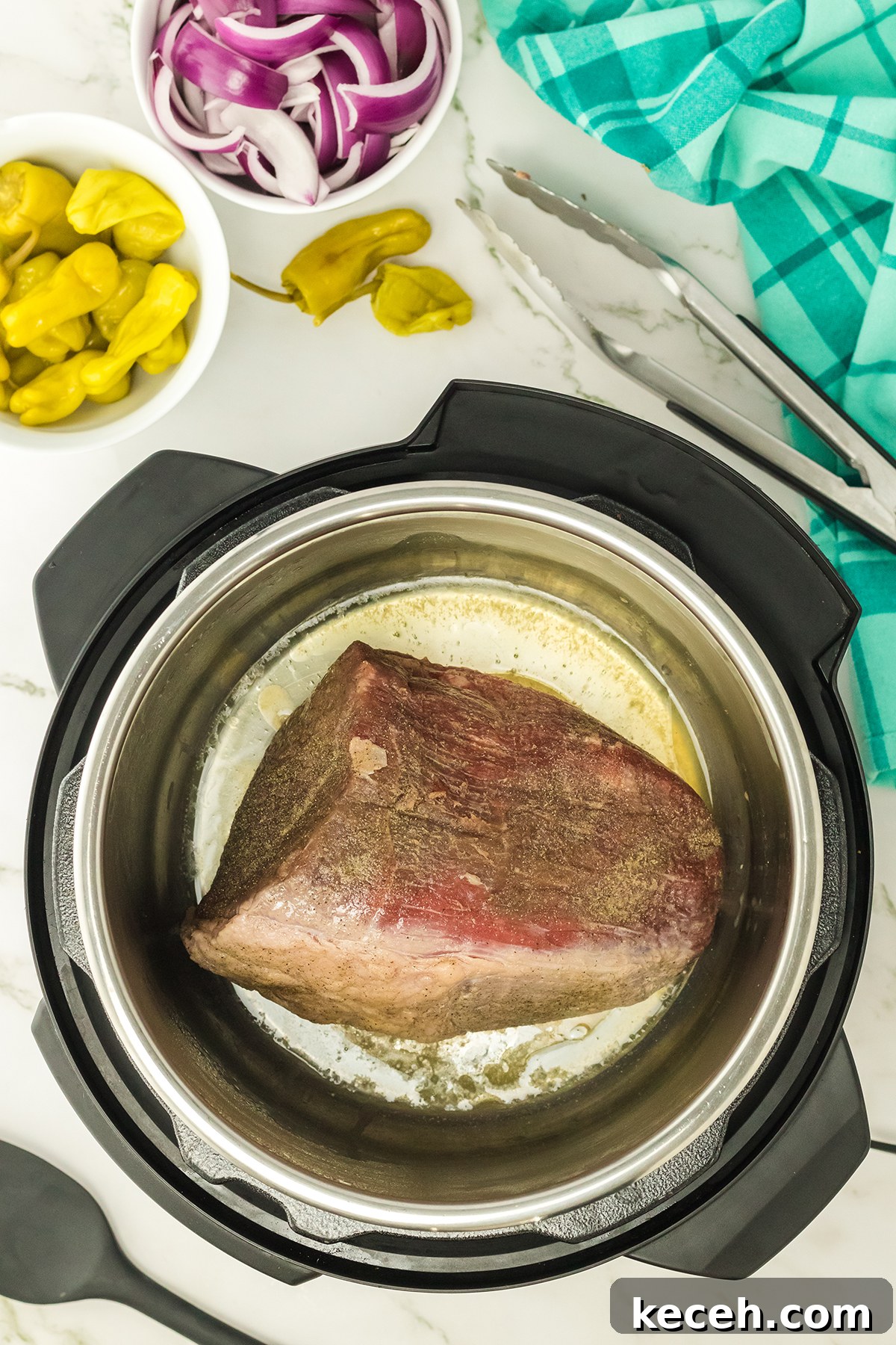 Seasoned Roast in Instant Pot ready to cook.