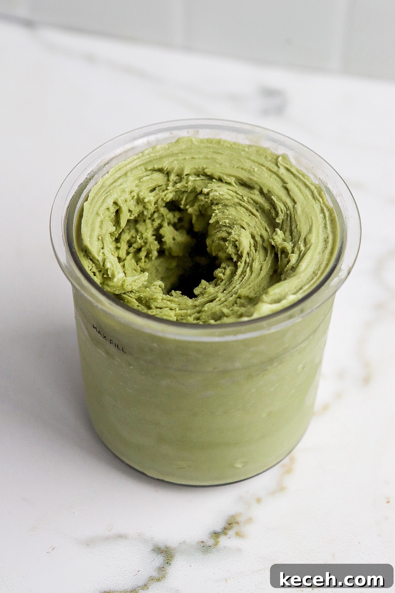 Side angle of ninja creami matcha ice cream in pint container.