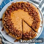 An overhead view of vegan cheesecake with a slice cut out