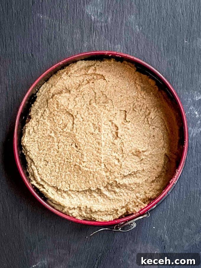 Vegan Pumpkin Cheesecake with Candied Pecans — Holiday Dessert Recipe 9 an overhead view of vegan cheesecake with pumpkin mousse in a springform pan