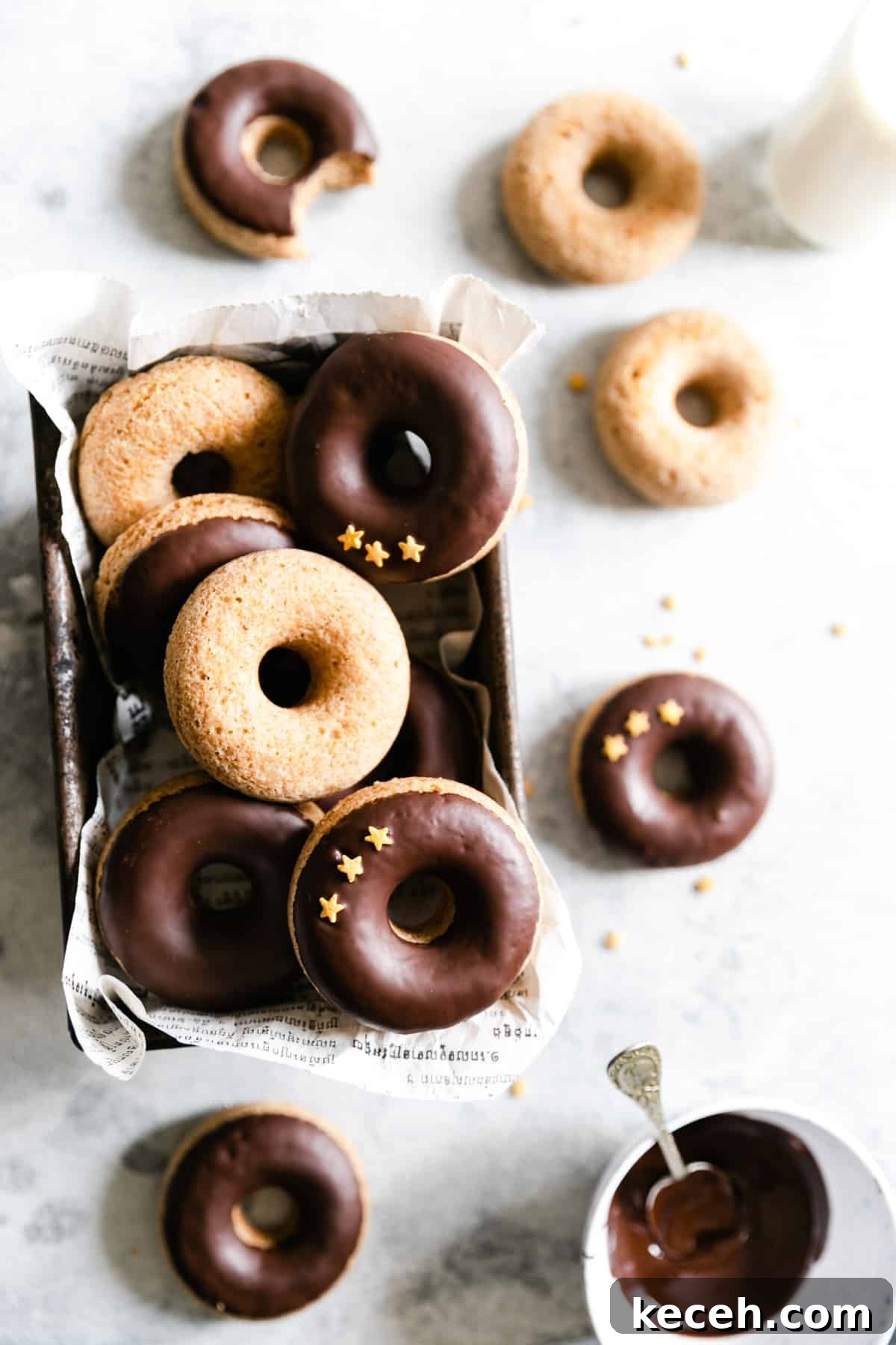 Baked Donuts with Rich Chocolate Glaze Recipe 11 overhead shot of old baking tin filled with baked doughnuts with chocolate glaze