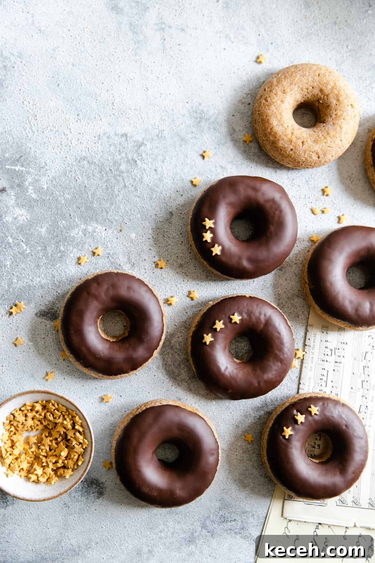 Baked Donuts with Rich Chocolate Glaze Recipe 14 overhead shot of baked doughnuts with chocolate glaze and star-shaped sprinkles