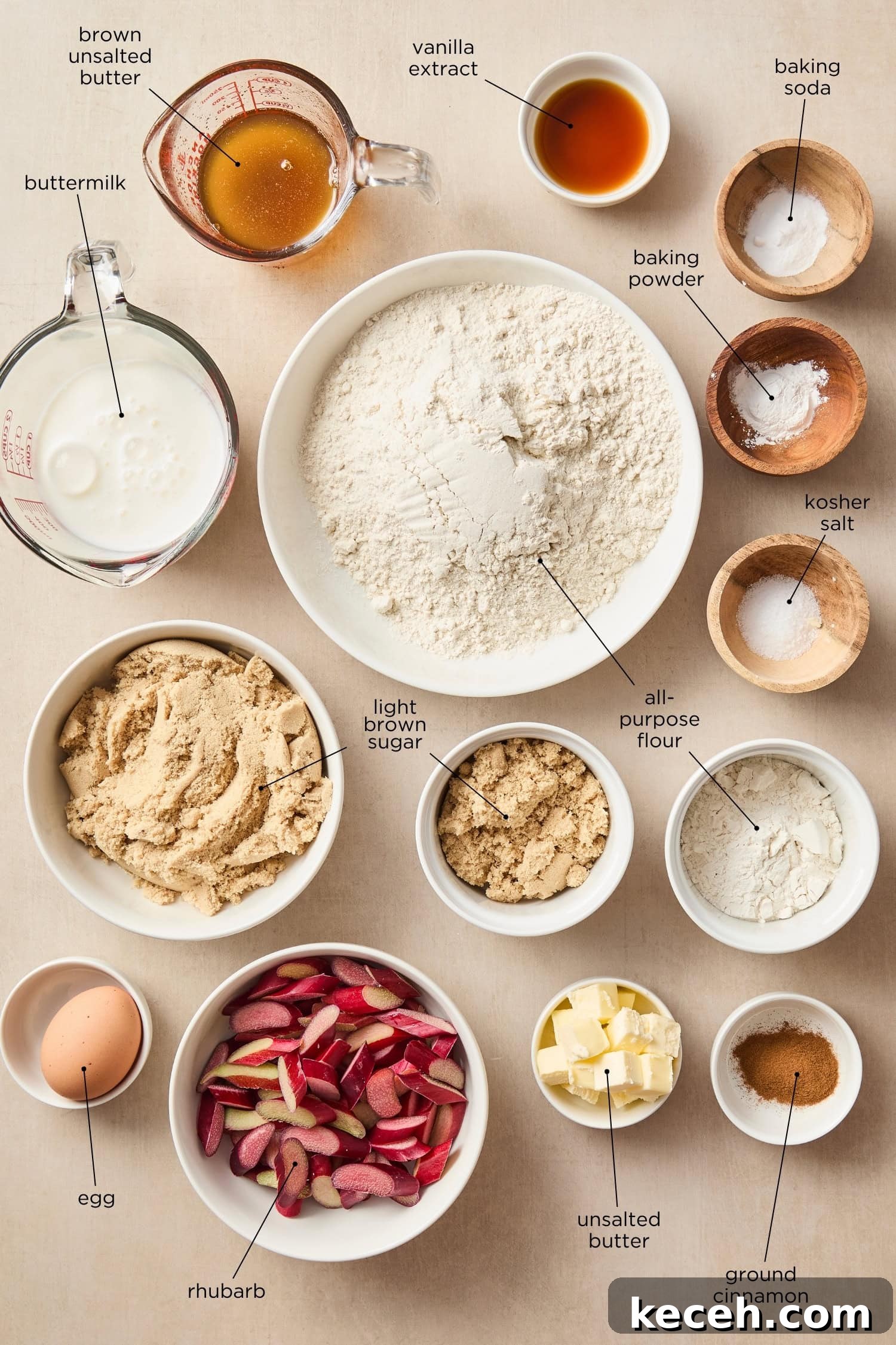 Tangy Rhubarb Muffins with Crunchy Streusel Topping 4 Surface with ingredients for muffins including flour, spices, and rhubarb.