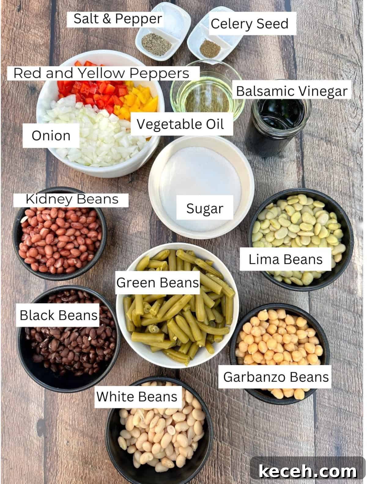Zesty Mixed Bean Salad with Lemon Herb Dressing 3 Cold Green Bean Salad ingredients arranged in individual bowls on a table with labels on each ingredient.
