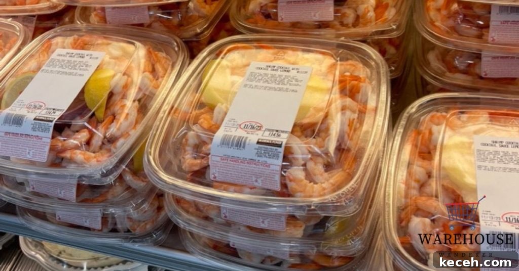 Costco shrimp cocktail platter with cooked shrimp, cocktail sauce, and lemon slices.