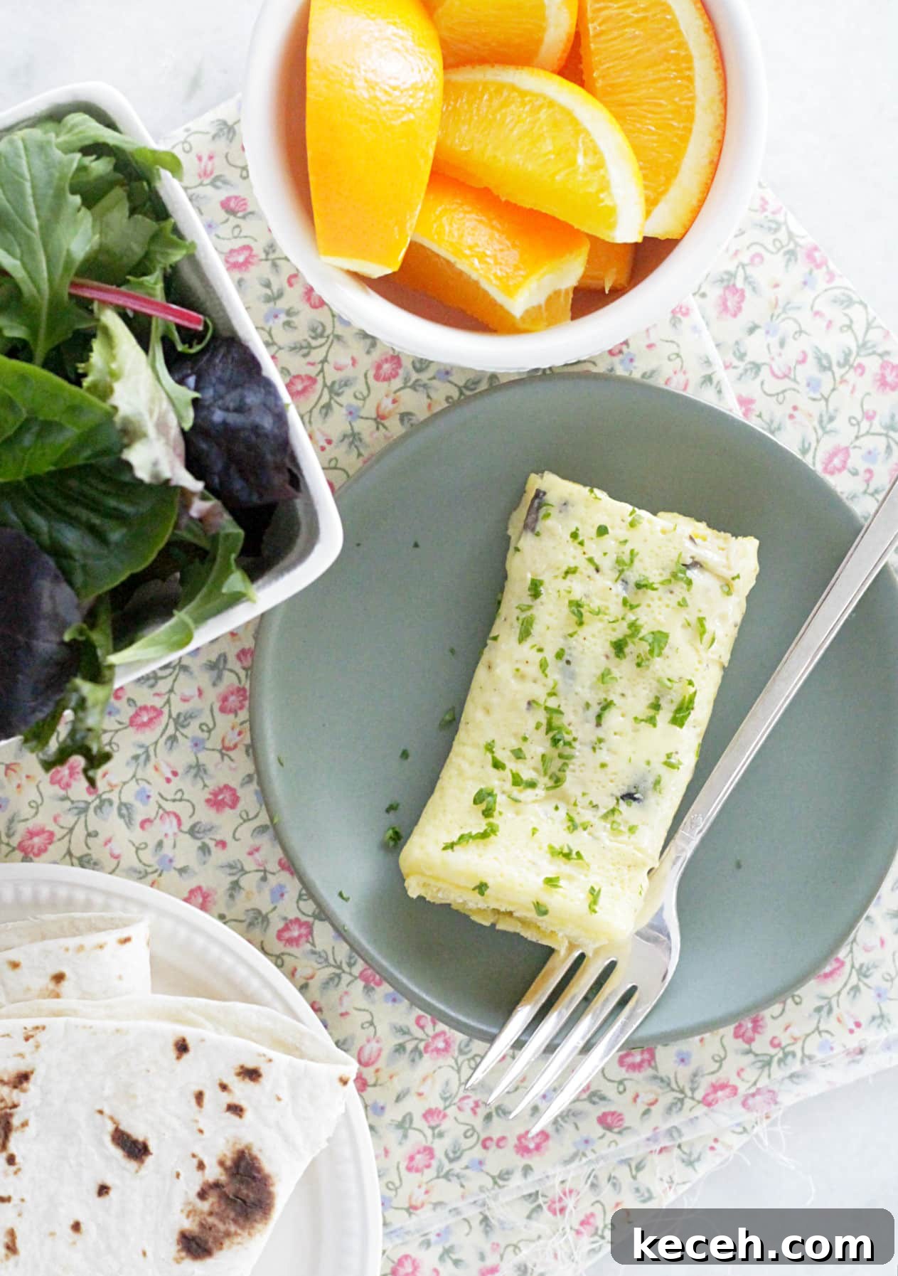 sheet pan omelettes with greens, tortilla and oranges