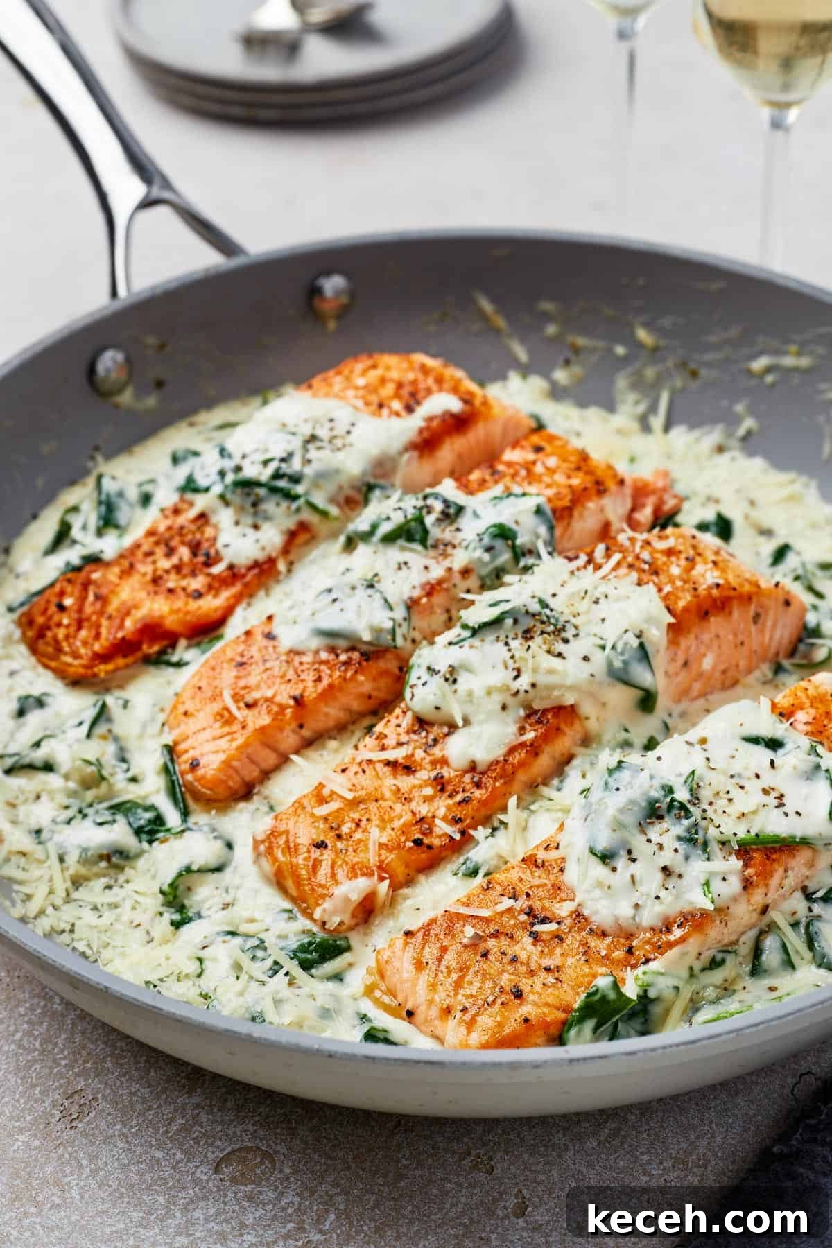 Creamy Spinach Salmon Florentine Recipe for Weeknight Dinners 3 Close-up shot of pan-fried salmon in Florentine sauce.