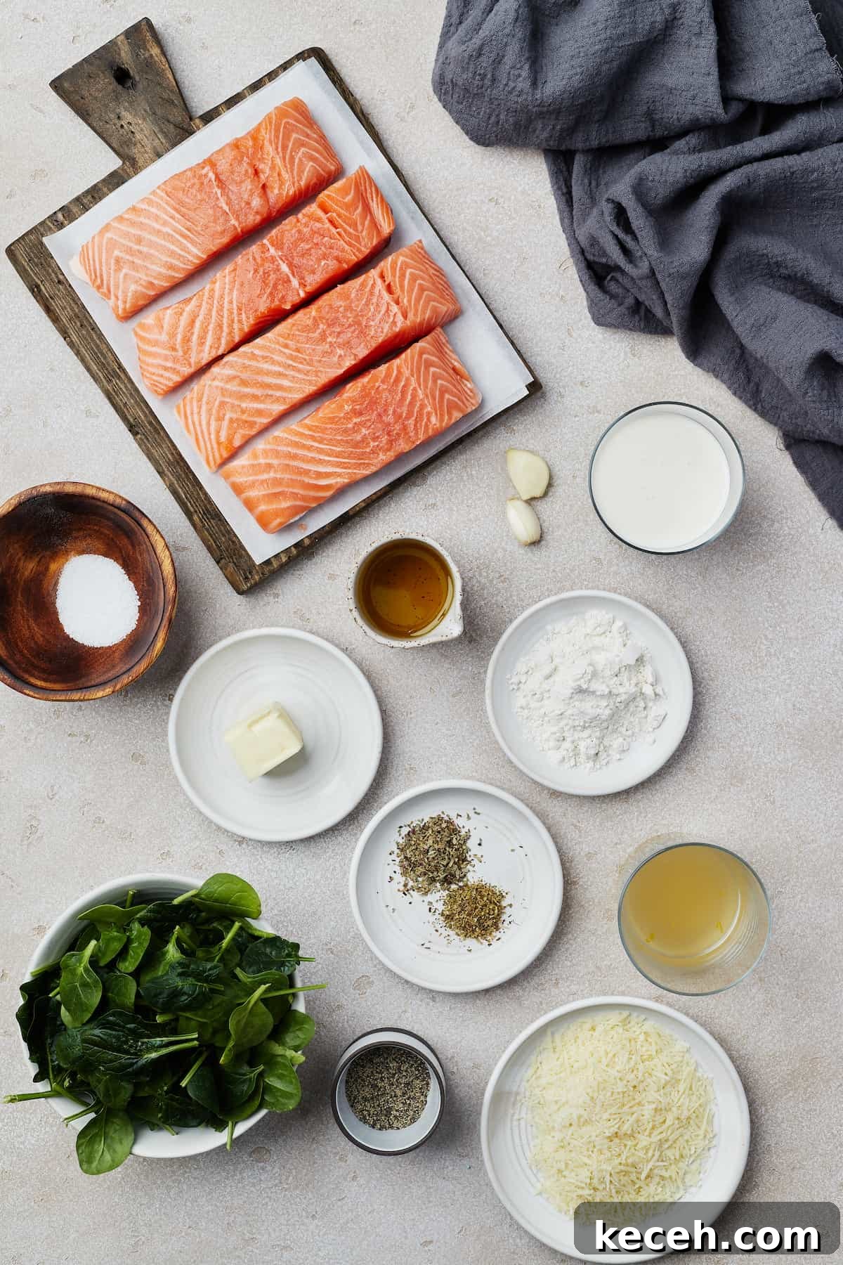 Creamy Spinach Salmon Florentine Recipe for Weeknight Dinners 4 From top left: salmon fillets, garlic, heavy cream, salt, butter, olive oil, flour, dried herbs, chicken broth, spinach, pepper, Parmesan cheese