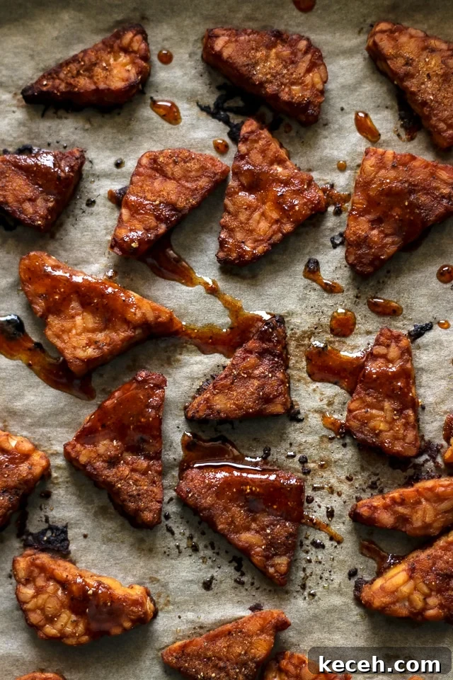 How to Cook Tempeh: Simple Techniques for Flavorful Results 11 Baked Tempeh Drizzled with Marinade on a Baking Sheet