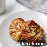 Tangzhong Method: Make Soft, Tender Breads and Buns Every Time 8 Close up view of a Swedish Cinnamon Bun (Kanelbullar).