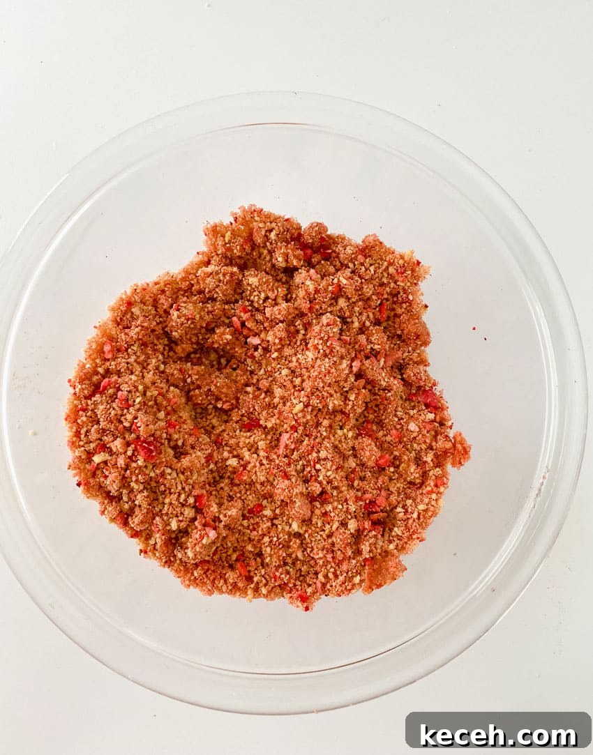 homemade strawberry crunch topping in a small glass mixing bowl