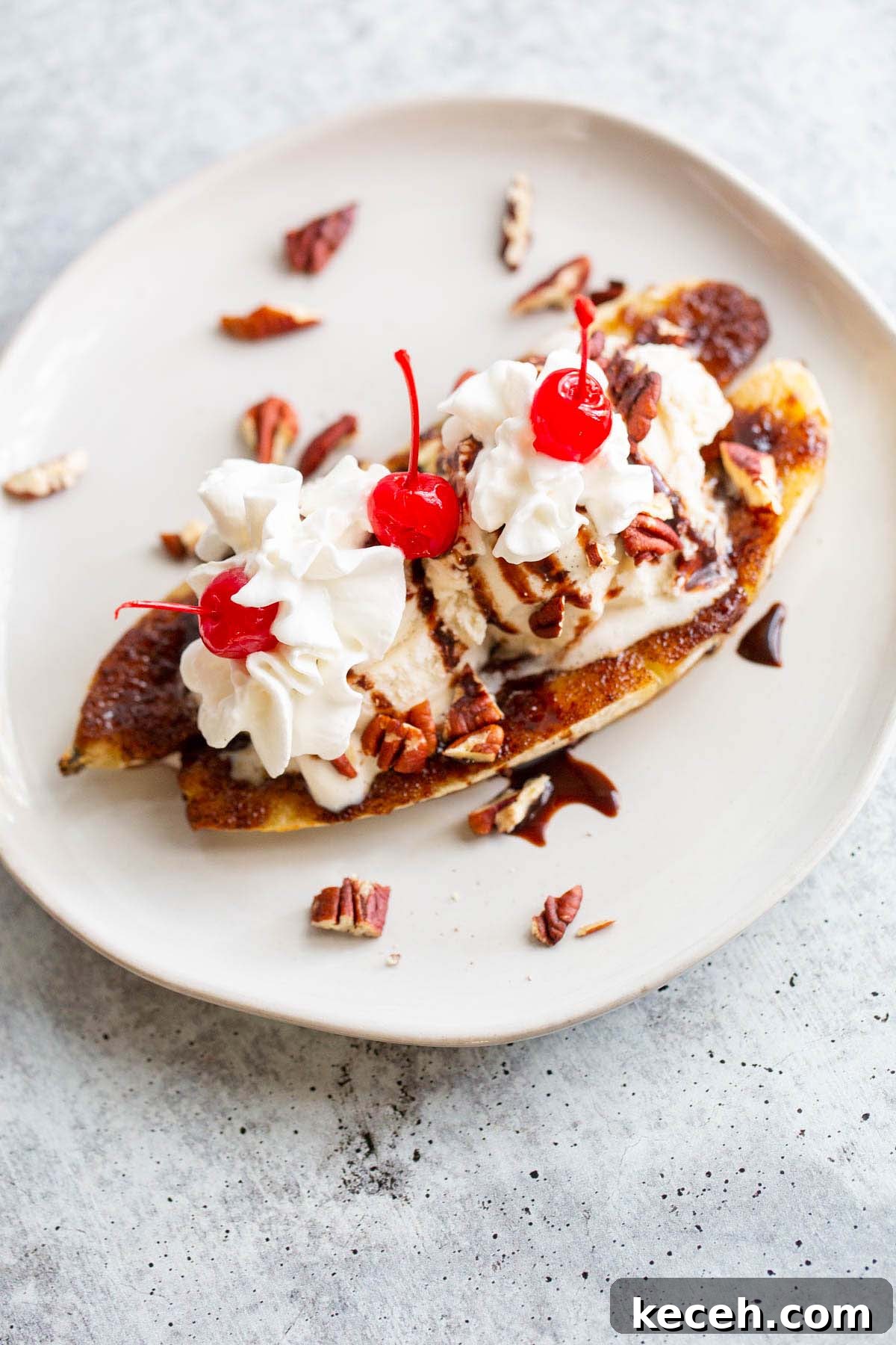 Air Fryer Banana Split Dessert with Warm Caramel and Crisp Toppings 8 Air fryer banana split from above.