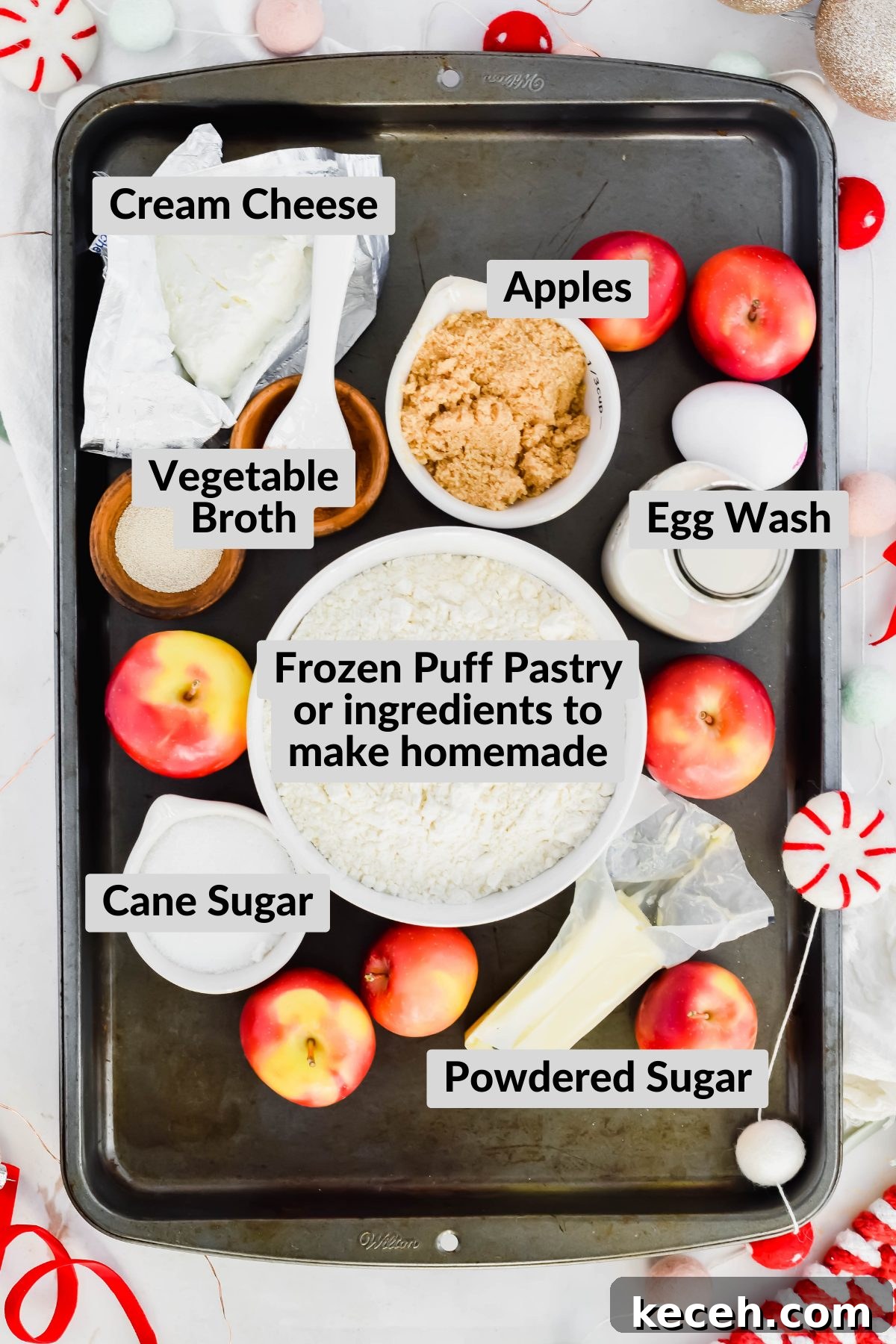 ingredients for cream cheese danishes in individual bowls on sheet pan.