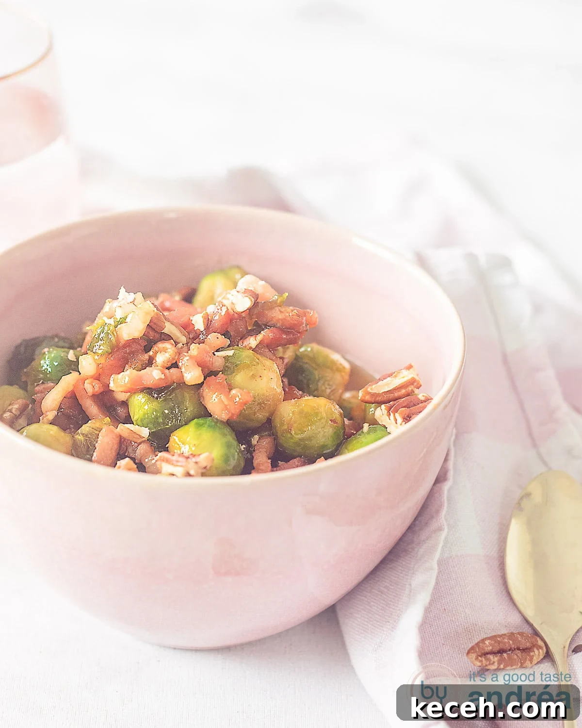 Bourbon-Glazed Brussels Sprouts with Crispy Bacon 8 A bowl with Brussels sprouts, bacon and pecans