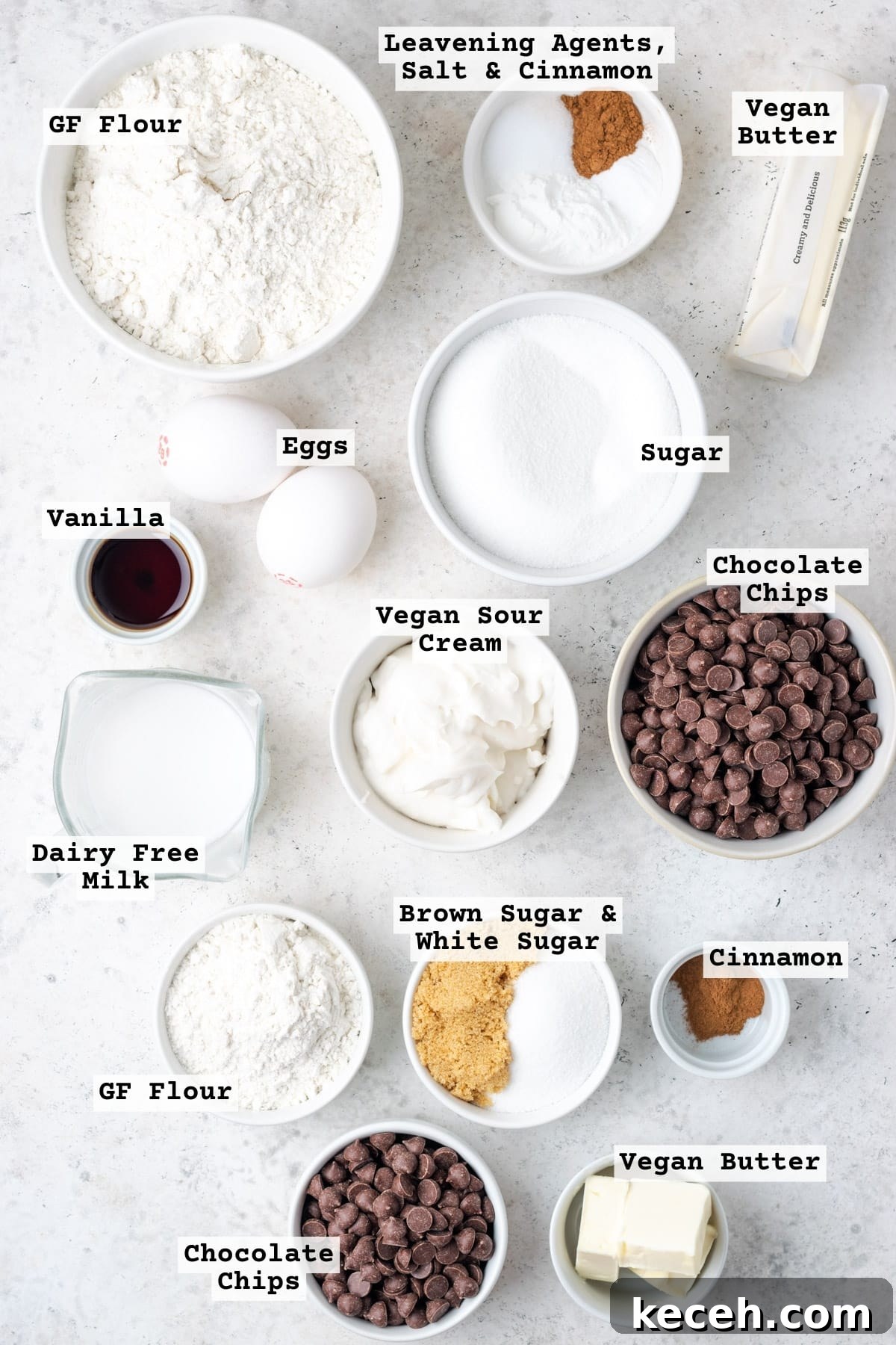 Ingredients for a chocolate chip coffee cake on a white table.