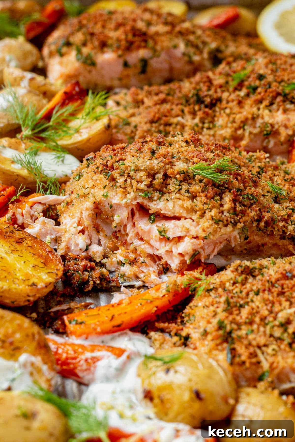 21 Flavorful Sheet Pan Dinners for Quick Weeknight Meals 6 herb crusted salmon with potatoes and carrots