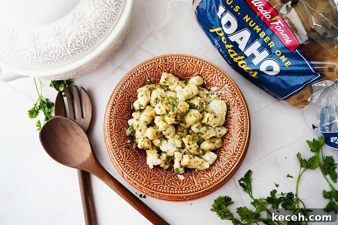 Pillowy Homemade Potato Gnocchi: Classic Italian Comfort Food 11 overhead shot of potato gnocchi in bowl with bag of wada farms idaho potatoes on the side