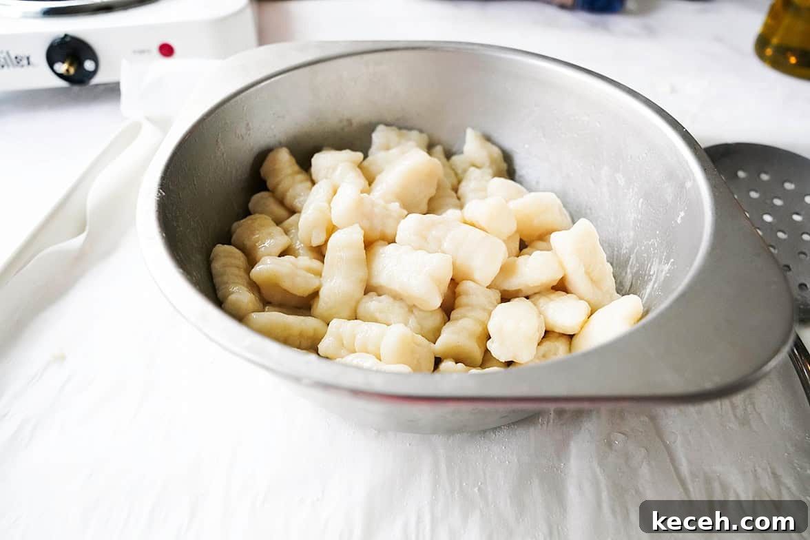Pillowy Homemade Potato Gnocchi: Classic Italian Comfort Food 3 potato gnocchi in stainless steel bowl