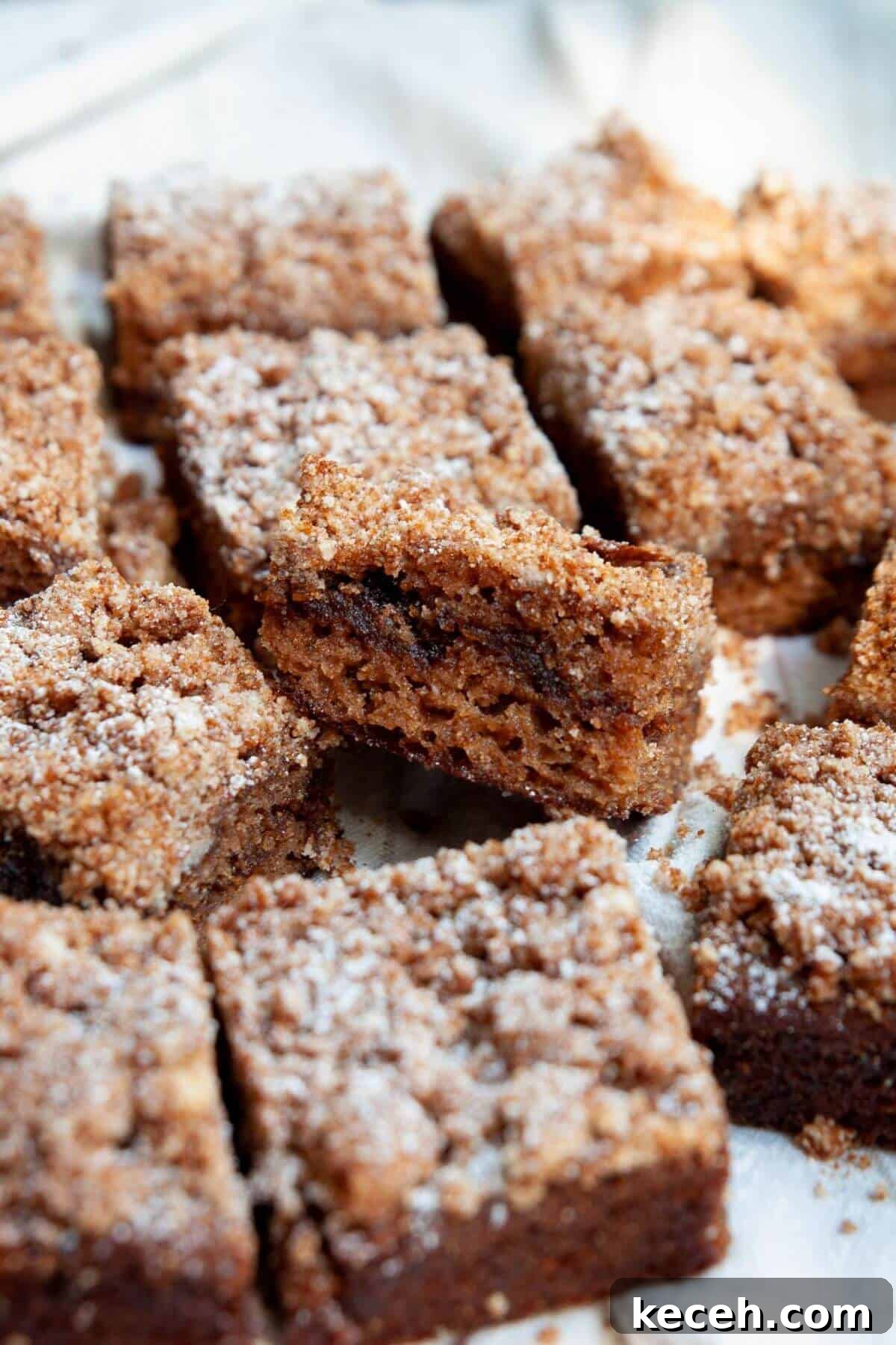 Moist Whole Wheat Coffee Cake with Yogurt and Honey 2 Healthy almond flour coffee cake sliced into squares with cinnamon swirl and crumb topping.