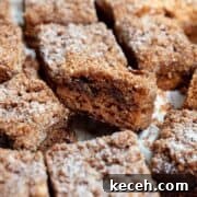 Moist Whole Wheat Coffee Cake with Yogurt and Honey 13 Healthy almond flour coffee cake sliced into squares with cinnamon swirl and crumb topping.