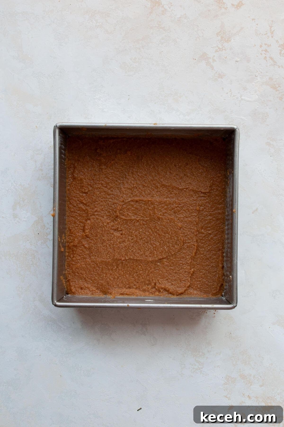 Moist Whole Wheat Coffee Cake with Yogurt and Honey 6 Half of coffee cake batter spread into a lined square baking pan.