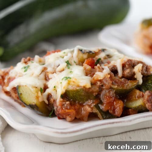 ground beef, zucchini, and tomatoes topped with shredded cheese.
