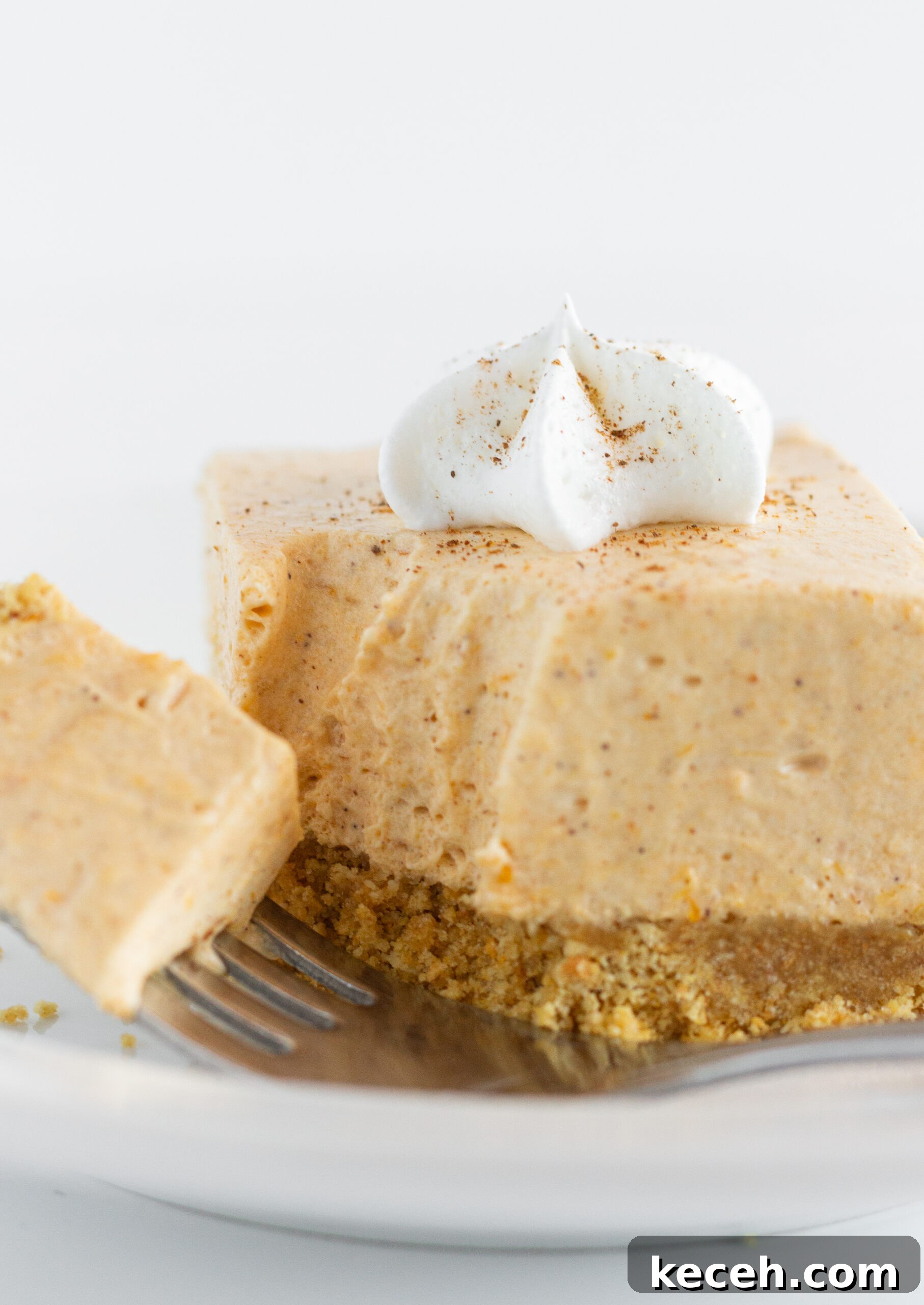 No-Bake Pumpkin Cheesecake Bars Recipe for Fall Desserts 6 No Bake Pumpkin Cheesecake Bars, by Top US dessert blog Practically Homemade