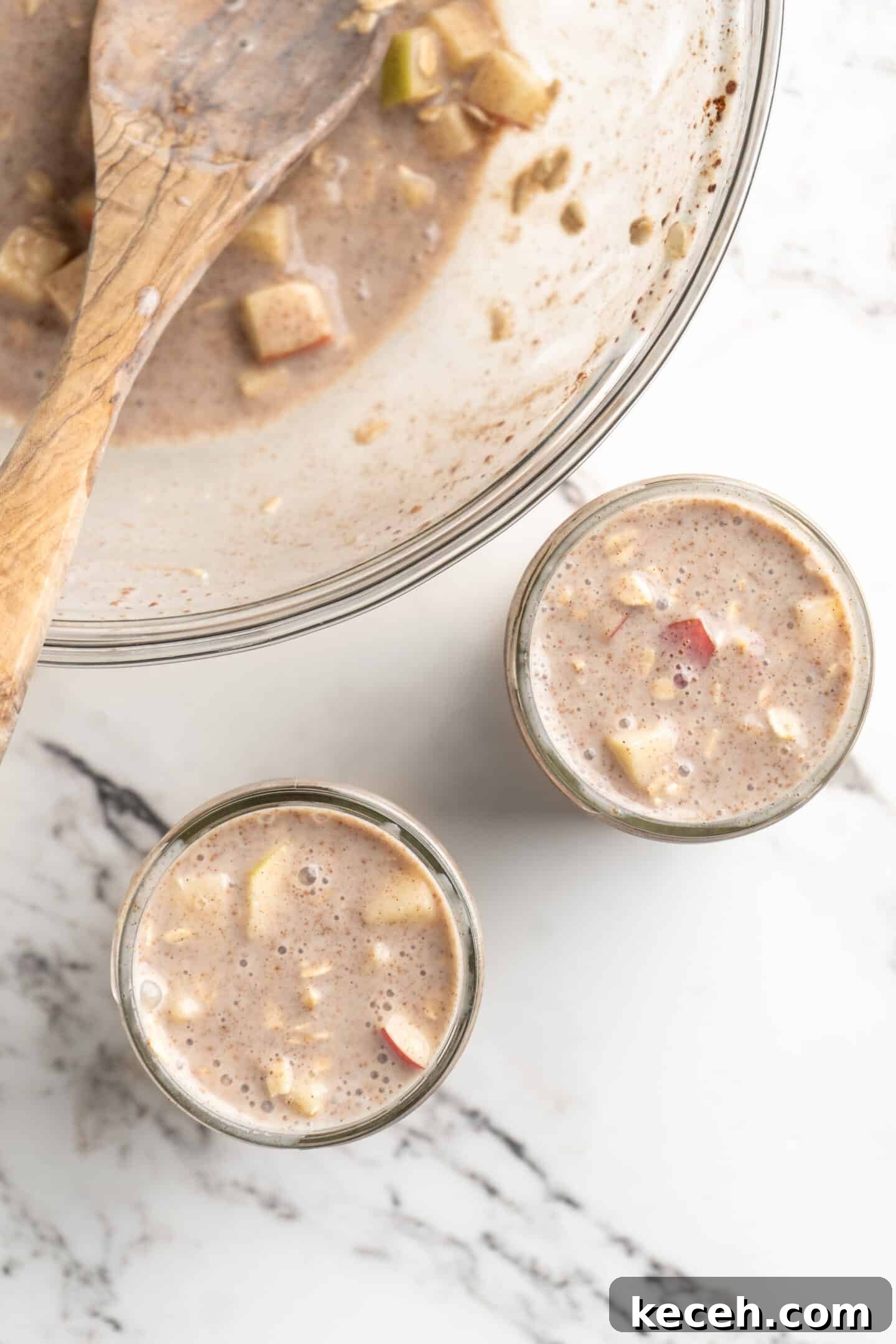 Apple Pie Overnight Oats Recipe for Cozy Fall M mornings 4 overhead shot of bowl of overnight oats plus two jars being filled