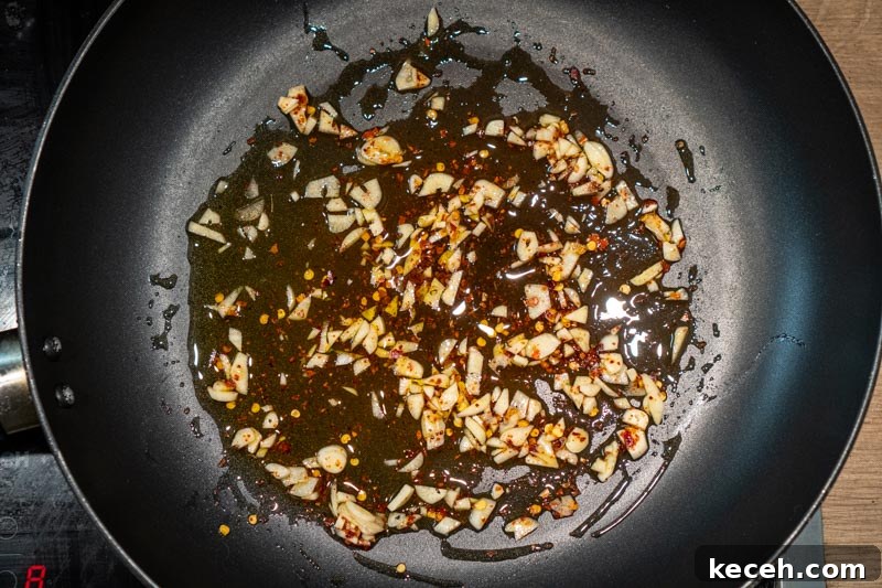 Vegan Puttanesca Sauce Recipe Without Anchovies 5 Adding chili and garlic to the pan