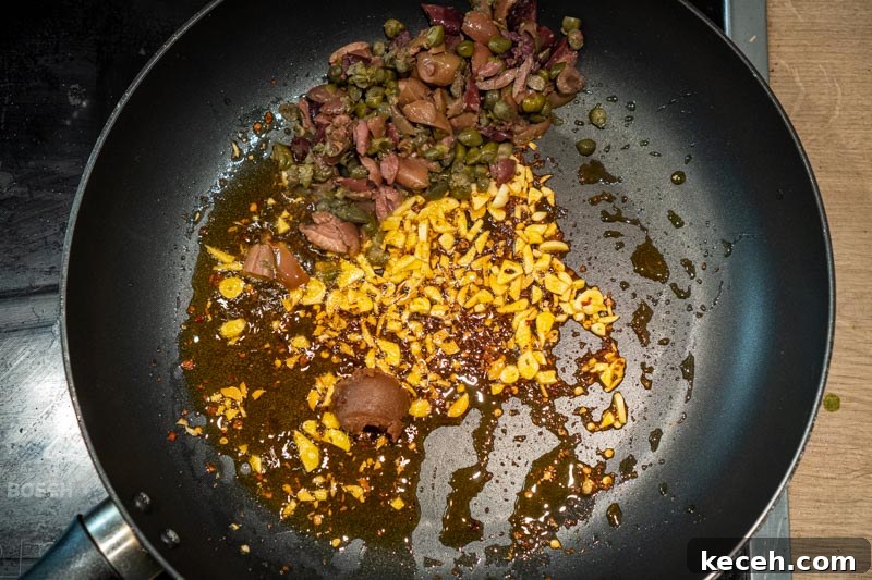 Vegan Puttanesca Sauce Recipe Without Anchovies 6 Adding the olives, capers and miso paste