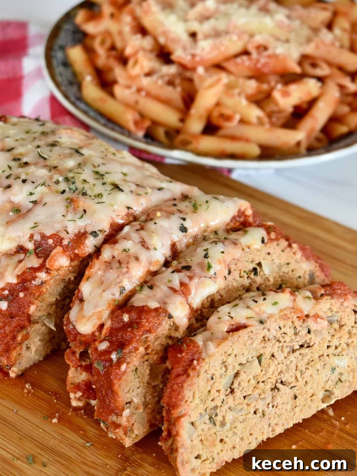 Italian-Style Turkey Meatloaf with Herbs and Parmesan 2 Italian turkey meatloaf recipe with mozzarella and marinara on top.