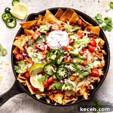 Family Meal Plan: Budget-Friendly Weekly Menu (Plan 138) 7 Loaded cheese nachos with chicken in a skillet.