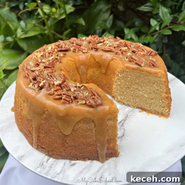 Maple Pound Cake, sliced, on a cake pedestal.