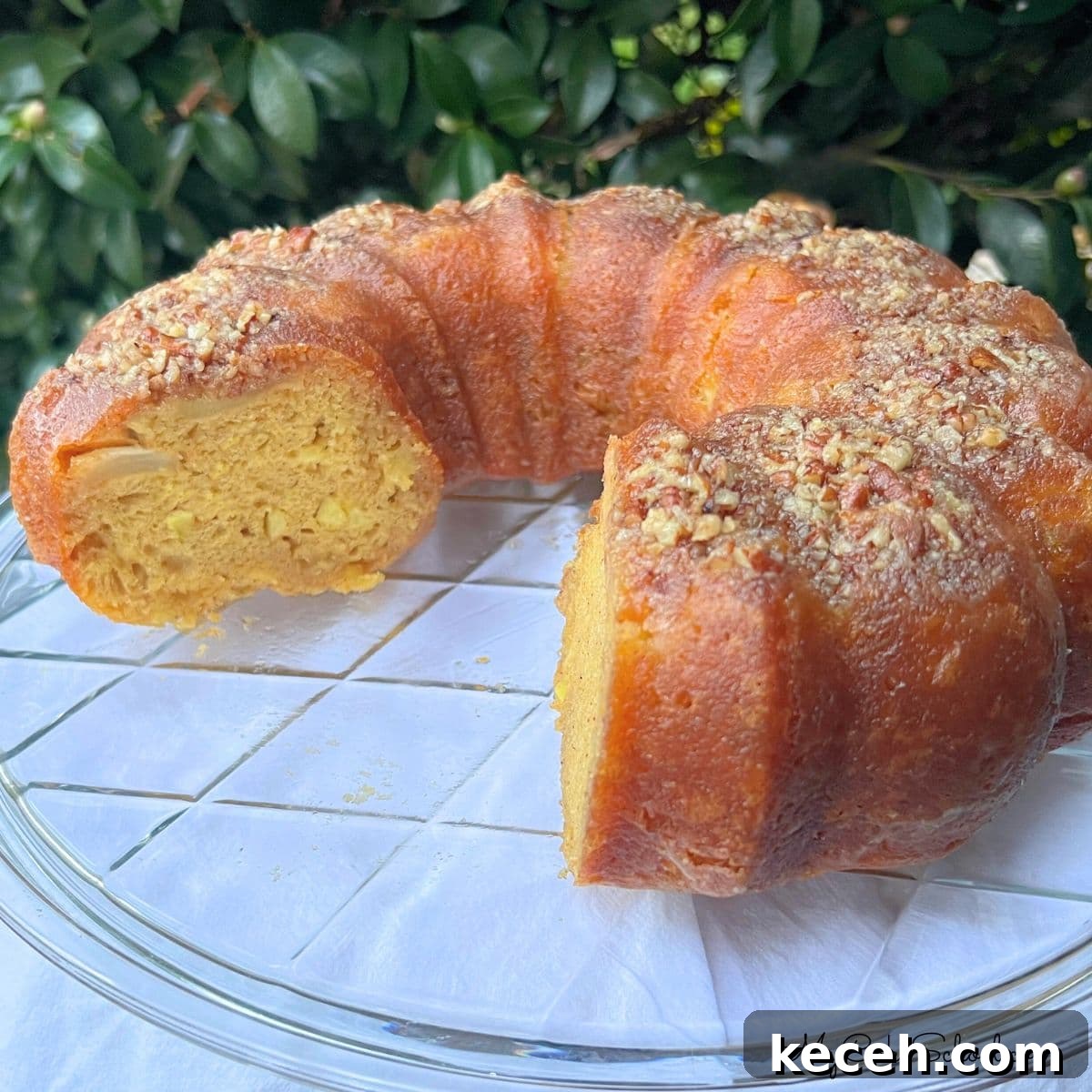 Apple Rum Cake on a cake plate.