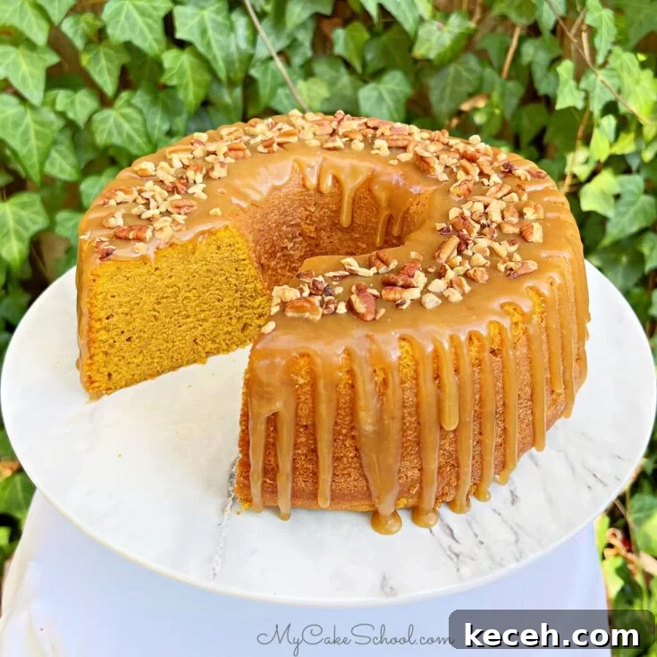 Sliced Pumpkin Bundt Cake on a cake pedestal.