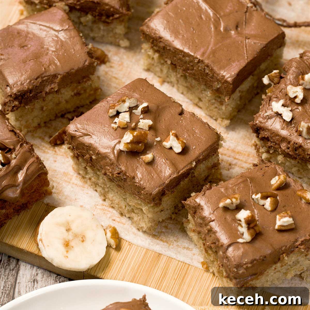 Gluten-Free Banana Cake with Chocolate Frosting Recipe 2 Gluten-free banana cake with chocolate cream cheese frosting cut into squares.