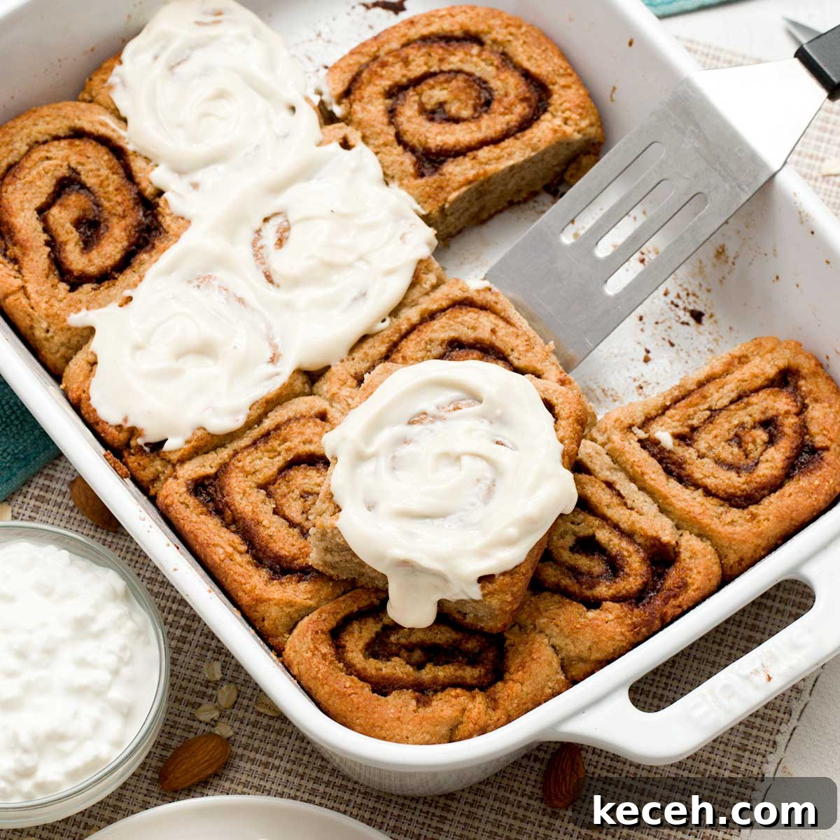 Gluten-Free Banana Cake with Chocolate Frosting Recipe 12 A baking dish with a batch of cottage cheese cinnamon rolls made gluten-free with oat and almond flour.