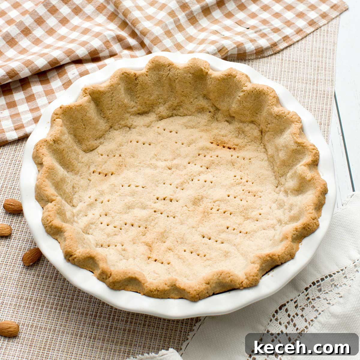 Gluten-Free Banana Cake with Chocolate Frosting Recipe 13 A gluten-free almond flour pie crust in a pie plate.