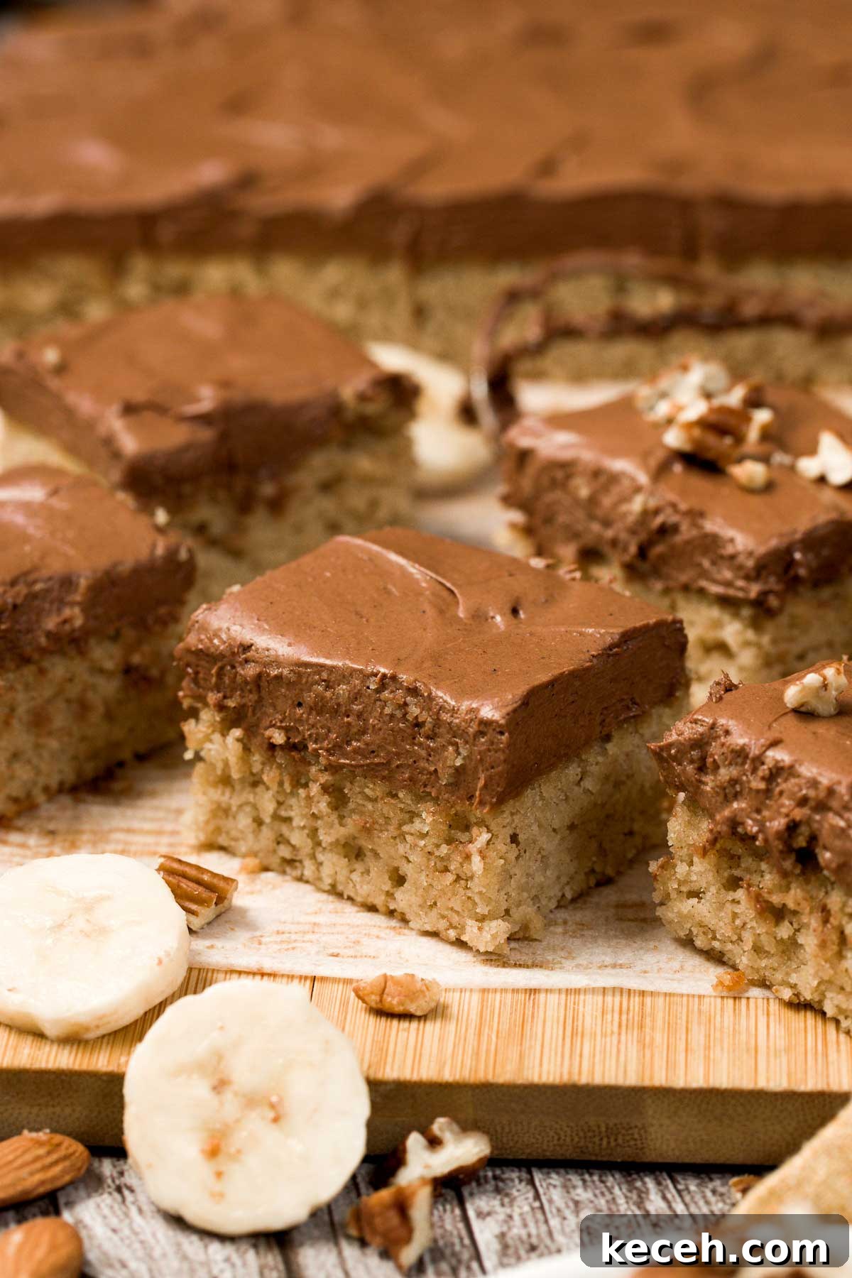 Gluten-Free Banana Cake with Chocolate Frosting Recipe 4 Gluten-free banana cake with chocolate cream cheese frosting cut into squares.