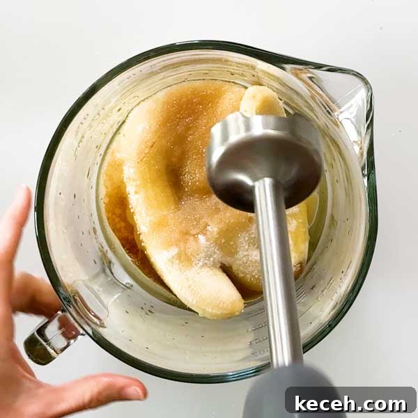 Gluten-Free Banana Cake with Chocolate Frosting Recipe 5 Mixing the batter with an immersion blender.