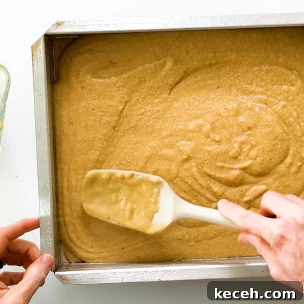 Gluten-Free Banana Cake with Chocolate Frosting Recipe 6 Spreading the cake batter in a pan.