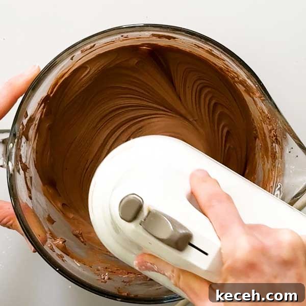 Gluten-Free Banana Cake with Chocolate Frosting Recipe 8 Mixing the chocolate cream cheese frosting.