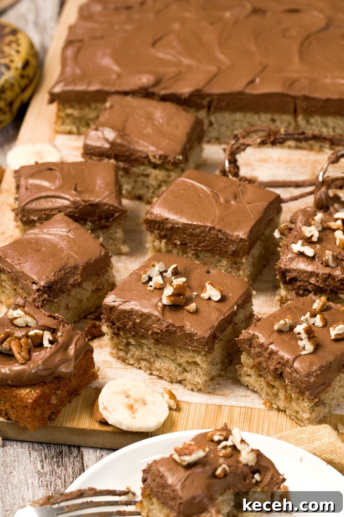 Gluten-Free Banana Cake with Chocolate Frosting Recipe 9 Gluten-free banana cake with chocolate cream cheese frosting cut into squares.
