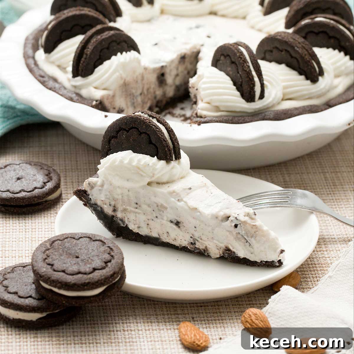 Gluten-Free Banana Cake with Chocolate Frosting Recipe 10 A gluten-free oreo cream pie with whipped cream on top and a slice on a plate.