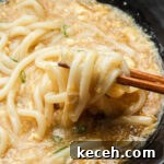 egg thick sauce udon noodles with chopsticks