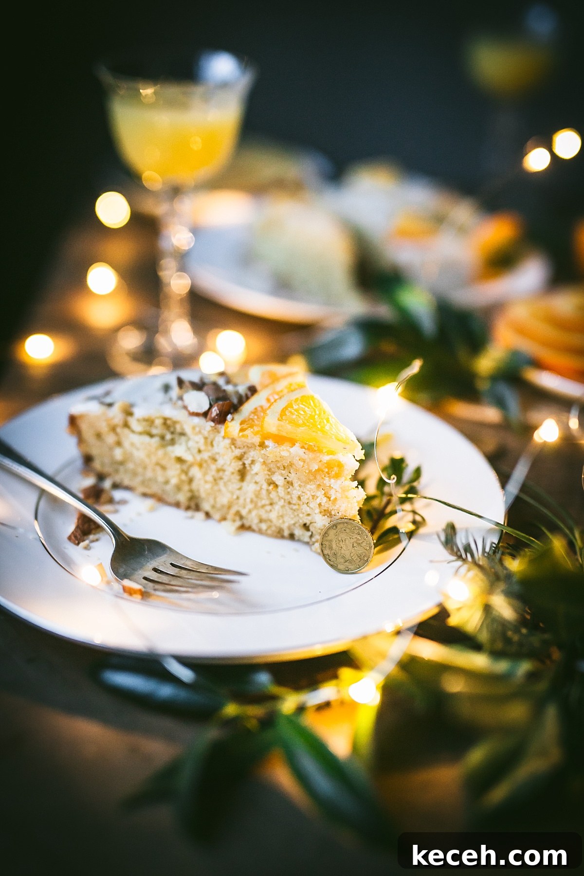 Vasilopita (Greek New Year Cake) — Slow Cooker or Oven Recipe 7 A good luck gold coin leans against slice of Vasilopita.