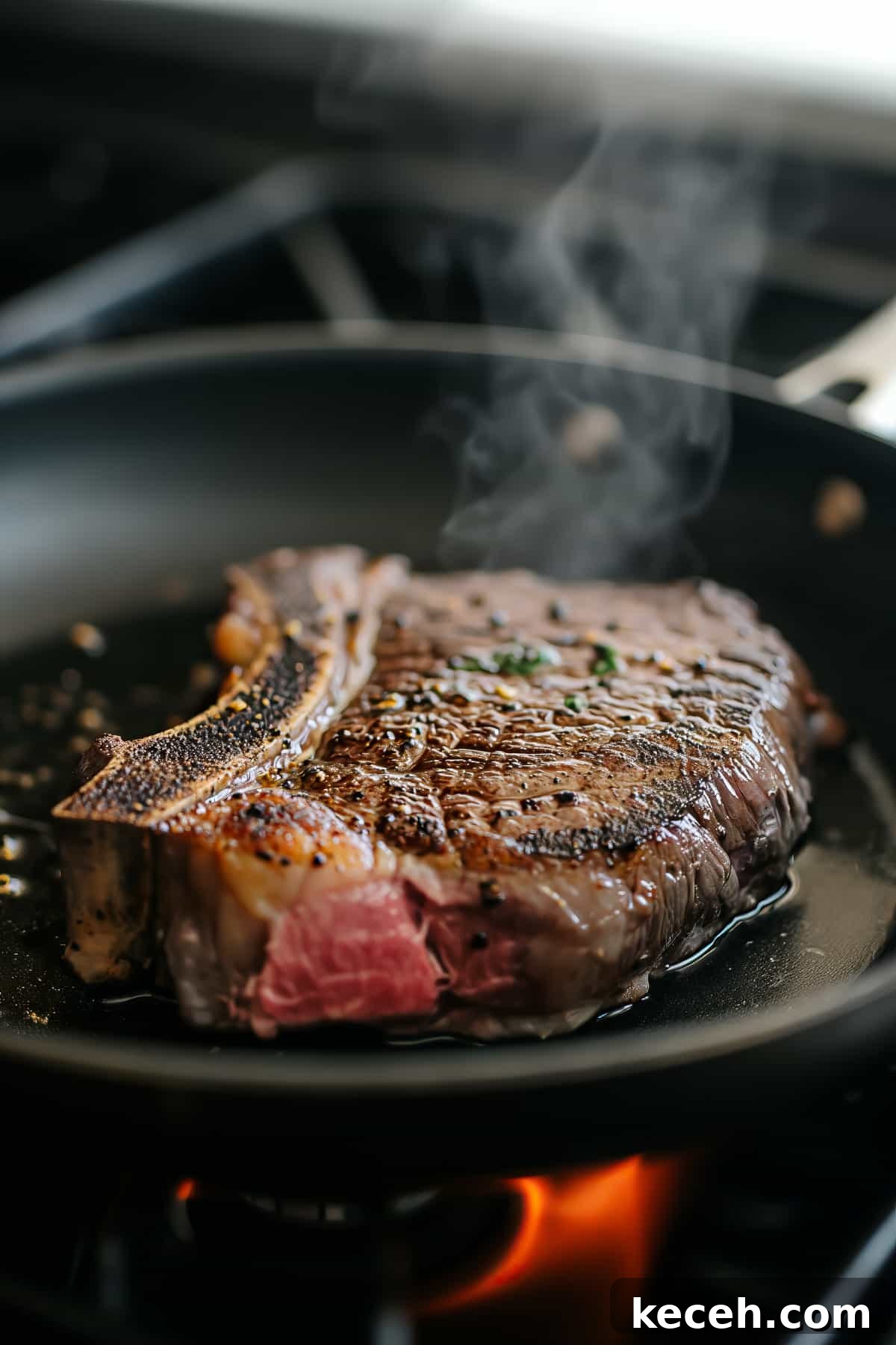 Perfect Ribeye Steak: Grill and Stove-Top Cooking Guide 3 Rib eye steak in a pan being seared.