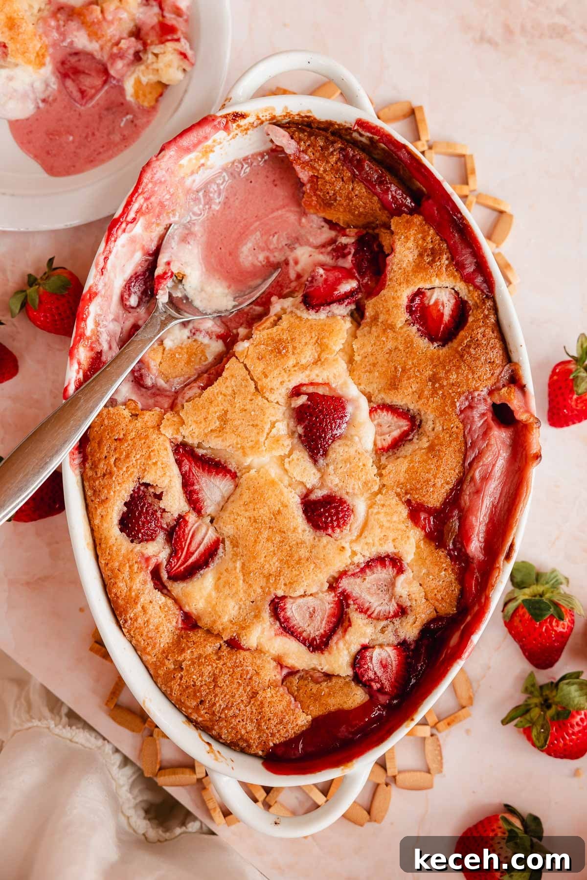 Cream Cheese Strawberry Cobbler Recipe — Sweet Rustic Dessert 12 strawberry cobbler with scoop taken out